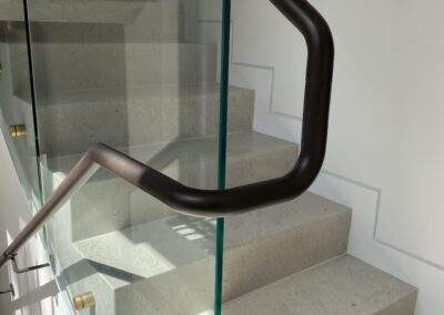 Glass Balustrades | Contemporary Stainless Solutions | Brass fixtures | stainless steel handrails | Custom