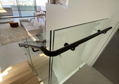 custom stainless steel staircase handrails and glass panels | residential | Contemporary Stainless Solutions